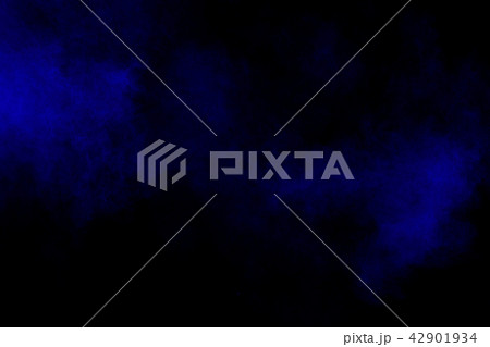 Abstract blue dust explosion on black background 42901934