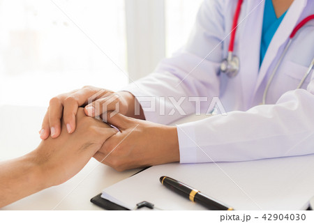 Doctor holding patient's hand. Doctor holding patient's hand. 42904030