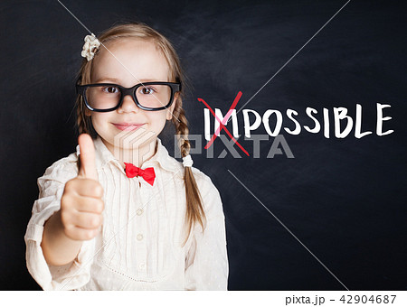 Smart child with thumb up and putting a cross over Smart child with thumb up and putting a cross over 42904687