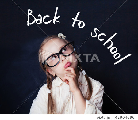 Little Student in Glasses Thinking In Classroom Little Student in Glasses Thinking In Classroom 42904696