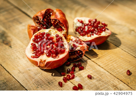 pomegranate fruit on an old wooden table 42904975