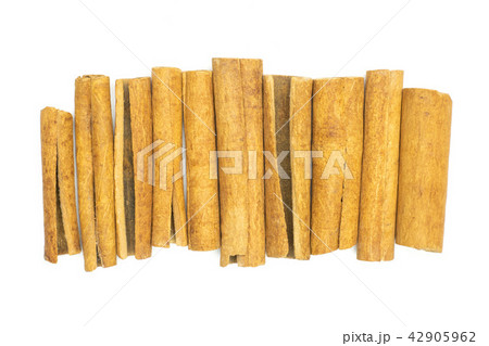 Dry brown cinnamon stick isolated on white Dry brown cinnamon stick isolated on white 42905962