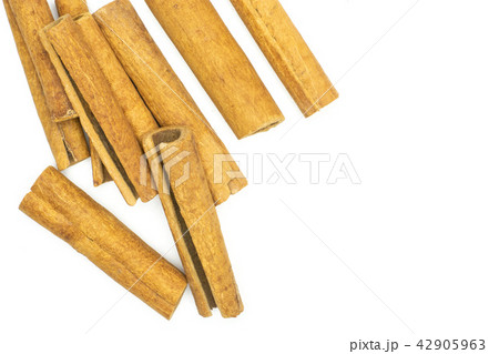 Dry brown cinnamon stick isolated on white Dry brown cinnamon stick isolated on white 42905963