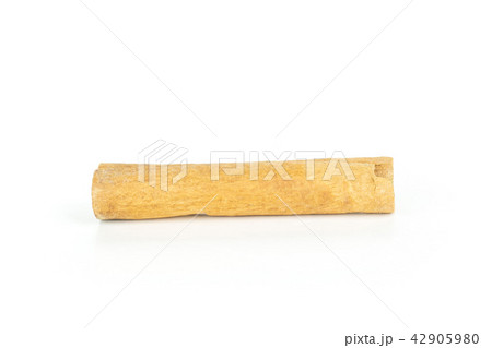 Dry brown cinnamon stick isolated on white Dry brown cinnamon stick isolated on white 42905980