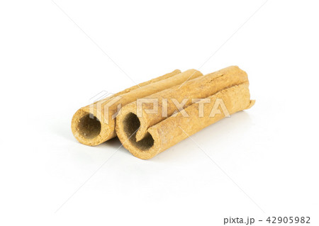 Dry brown cinnamon stick isolated on white Dry brown cinnamon stick isolated on white 42905982
