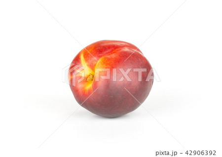 Ripe deep red nectarine isolated on white Ripe deep red nectarine isolated on white 42906392