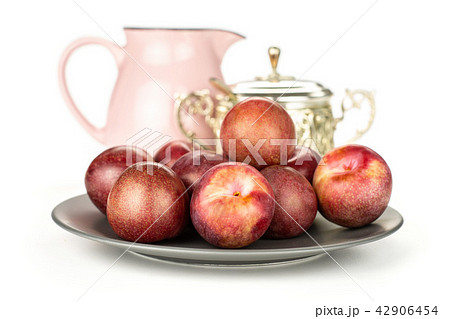 Fresh pluot interspecific plums isolated on white Fresh pluot interspecific plums isolated on white 42906454