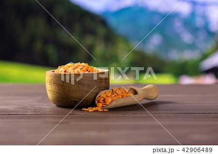 Raw red lentils with country nature Raw red lentils with country nature 42906489