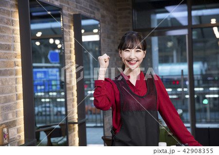 Hairdresser styling woman's hair in a salon. Korean beauty stock photo. 190 Hairdresser styling woman's hair in a salon. Korean beauty stock photo. 190 42908355