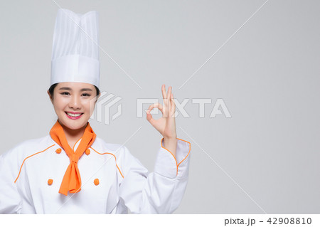 Chef, Cook or baker showing display gesture on empty copy space.Woman chef isolated on white background. 178 Chef, Cook or baker showing display gesture on empty copy space.Woman chef isolated on white background. 178 42908810