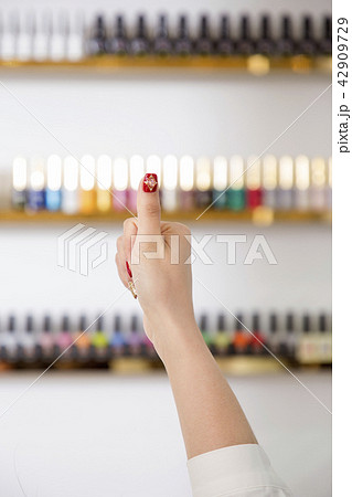 Nail salon woman hands treatment. Nail saloon woman painting color nail polish in hands stock photo. 087 Nail salon woman hands treatment. Nail saloon woman painting color nail polish in hands stock photo. 087 42909729