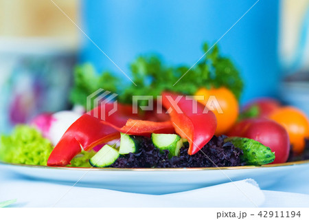 Plate with sliced vegetables. Tasty snack concept Plate with sliced vegetables. Tasty snack concept 42911194