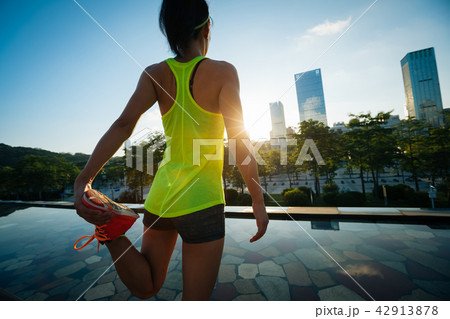 woman runner warming up before running 42913878