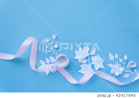 frame with white paper flowers and pink ribbon 42917840