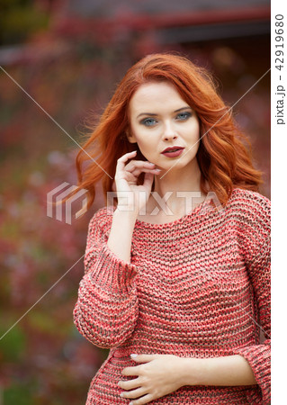 Outdoor lifestyle photo of young beautiful lady. red hair . War Outdoor lifestyle photo of young beautiful lady. red hair . War 42919680