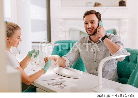 Handsome metrosexual visiting fancy nail salon Handsome metrosexual visiting fancy nail salon 42921738