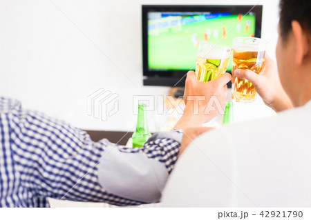 Asian football supporters group of friend watching soccer sport Asian football supporters group of friend watching soccer sport 42921790