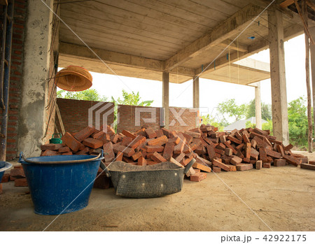 Pile of red brick stand by for installing the wall 42922175