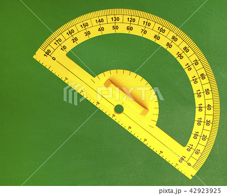 The yellow angle protractor on green chalkboard 42923925