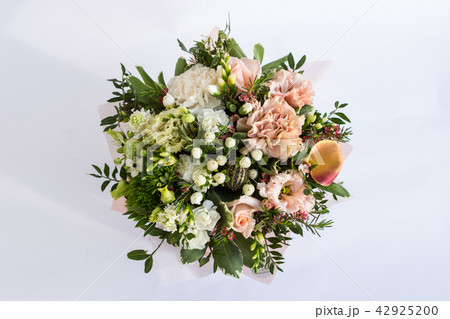 Flat lay of a beautiful florish bouquet composition on the white background 42925200