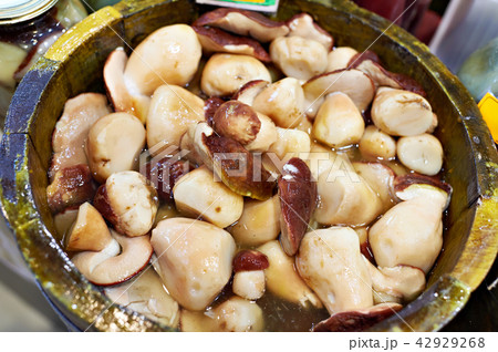 Salted white mushrooms on barrel 42929268