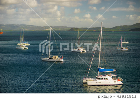 Luxury yachts anchored in the blue water with fort on background 42931913