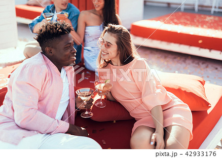 Smiling girl and male tasting delicious beverage Smiling girl and male tasting delicious beverage 42933176