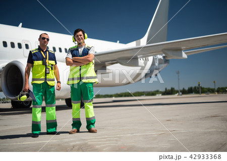 Cheerful workers at airport Cheerful workers at airport 42933368