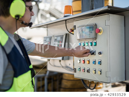 Aviation mechanic working with technical equipment 42933529