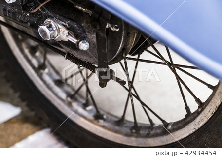 Front wheel of old retro motorcycle close-up Front wheel of old retro motorcycle close-up 42934454