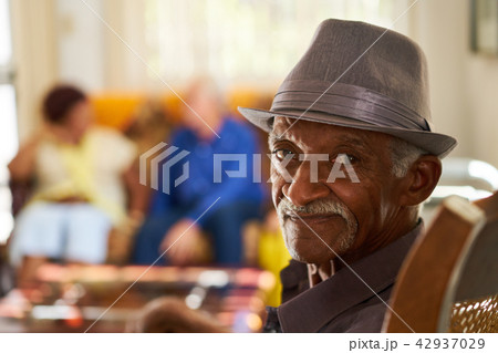 Senior Black Man With Hat Looking At Camera In Hospice Senior Black Man With Hat Looking At Camera In Hospice 42937029