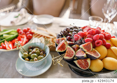Different meals for the guests on Banquet table. delicious dishes on the table in the restaurant Different meals for the guests on Banquet table. delicious dishes on the table in the restaurant 42943174