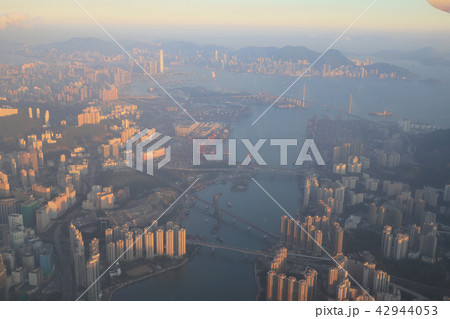 view of plane window looking down of a land 42944053