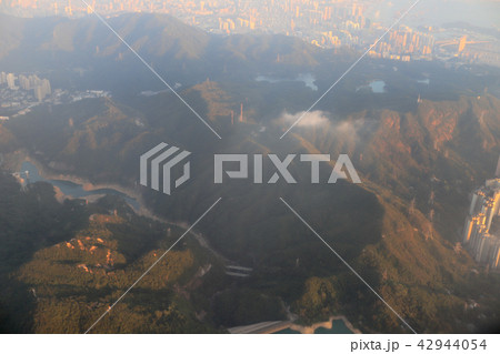 view of plane window looking down of a land 42944054
