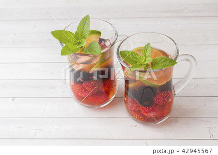 Cocktail with black currant, strawberry, mint  Cocktail with black currant, strawberry, mint  42945567