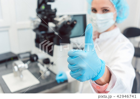 Doctor in fertility lab having just fertilized a human egg 42946741