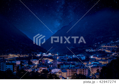Mountain village under Milky Way night sky Mountain village under Milky Way night sky 42947274