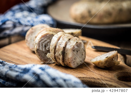 Sliced tasty white sausage. 42947807