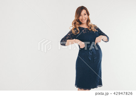 pregnant woman holding hands on belly pregnant woman holding hands on belly 42947826