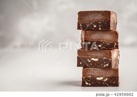 Stack of chocolate fudge bars on white background. Stack of chocolate fudge bars on white background. 42950002