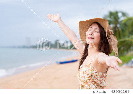 Young woman with hat at beach. Summer concept Young woman with hat at beach. Summer concept 42950162