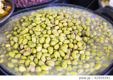 A lot of fresh green olives in a bowl A lot of fresh green olives in a bowl 42950391