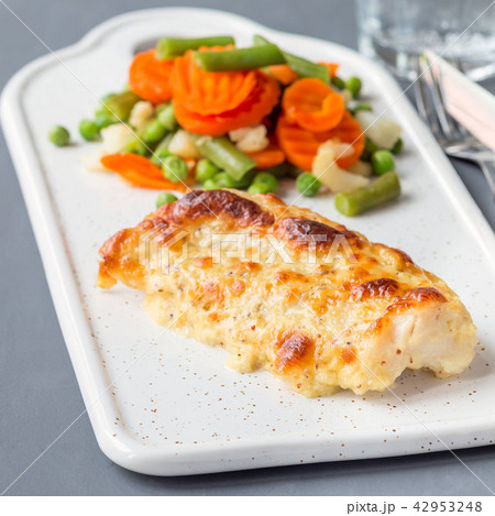 Baked cod fish fillet under cheese crust Baked cod fish fillet under cheese crust 42953248