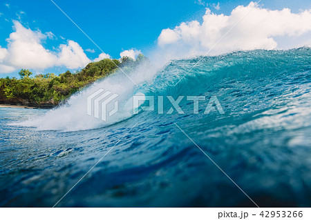 Blue barrel wave in ocean. Wave and sky in Bali Blue barrel wave in ocean. Wave and sky in Bali 42953266