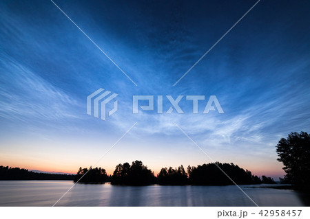 Night shining clouds over lake Night shining clouds over lake 42958457