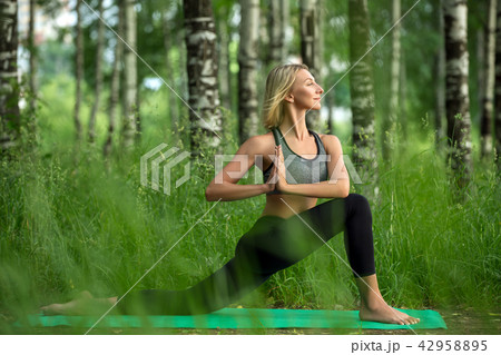 Young girl doing yoga in a birch-tree grove shot Young girl doing yoga in a birch-tree grove shot 42958895