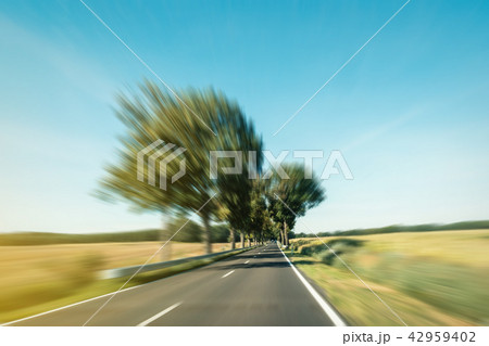 driving fast road in rural landscape motion blur driving fast road in rural landscape motion blur 42959402