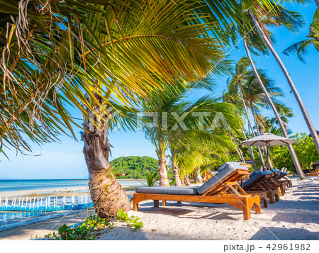 Umbrella and chair on the beach and sea ocean with blue sky Umbrella and chair on the beach and sea ocean with blue sky 42961982