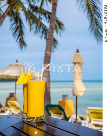 Iced drinking glass with mango smoothies Iced drinking glass with mango smoothies 42963192