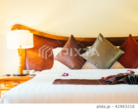 Comfortable pillow on bed decoration in hotel bedroom Comfortable pillow on bed decoration in hotel bedroom 42963218